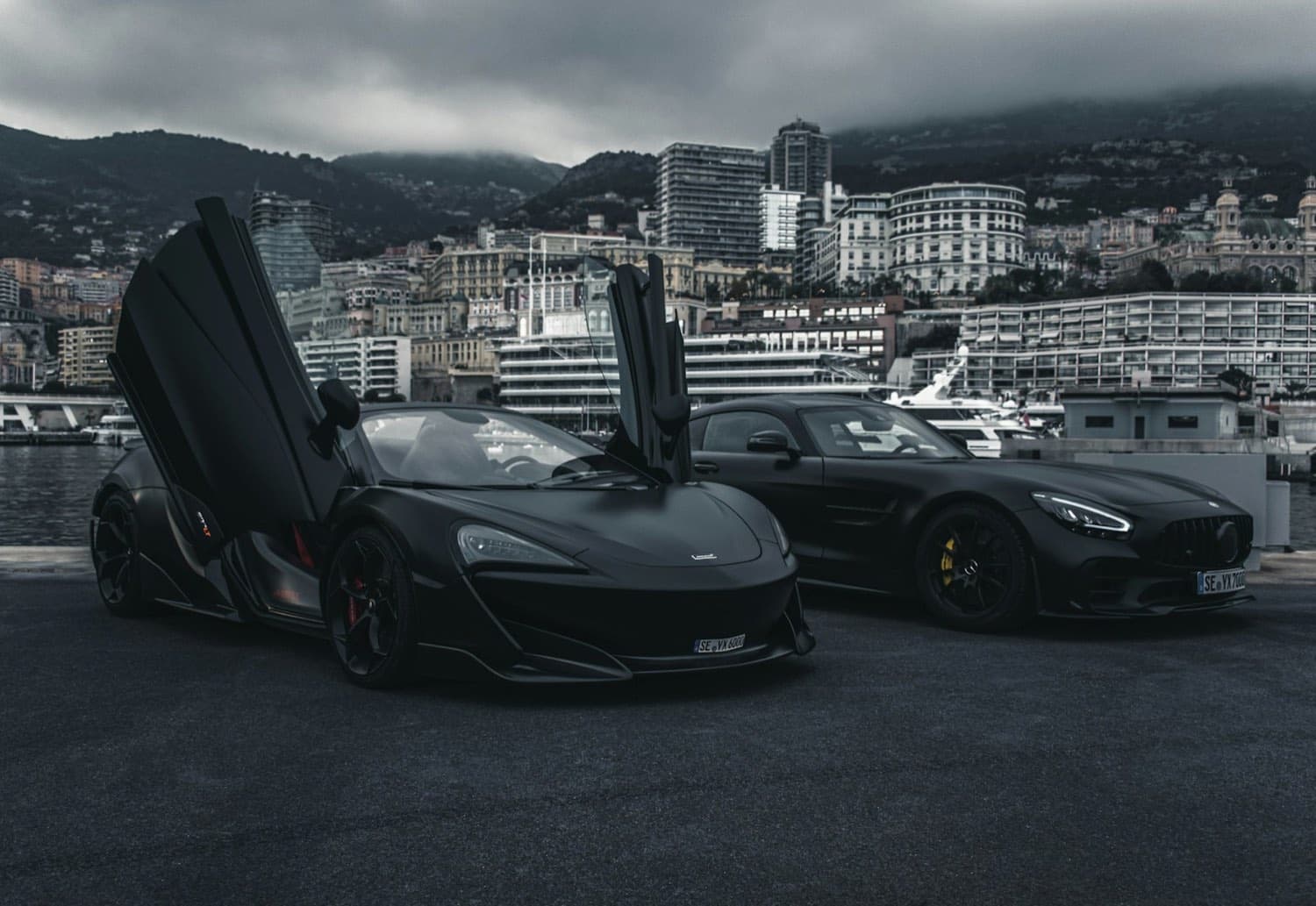 Supercars gathered outside the Apex Autohaus showroom at night